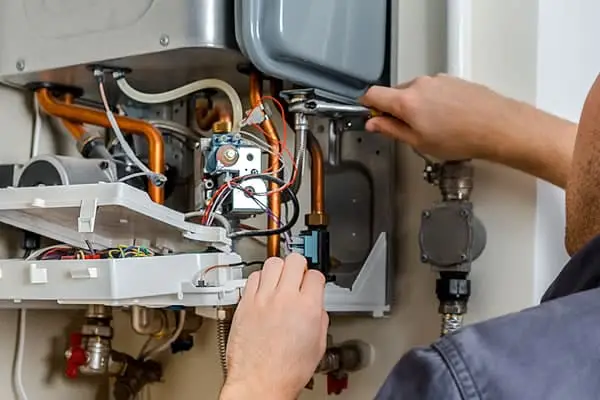 A Videtta engineer servicing a boiler